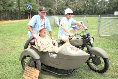 Keith riding his cycle with Gomer in sidecar.