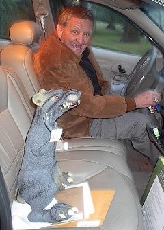 George leaves gathering with his new giant rubber rat.